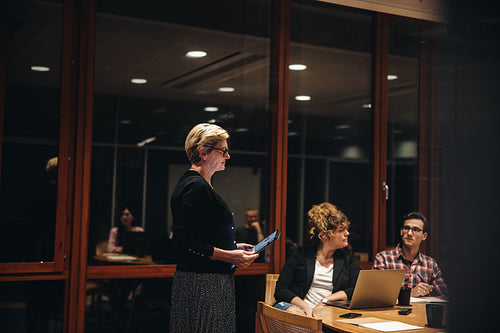Business professionals having a meeting in boardroom
