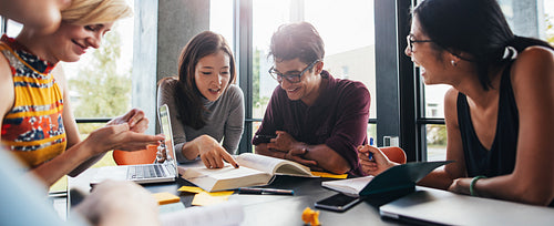 University students doing group study in library