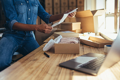 Female preparing shipment for delivery