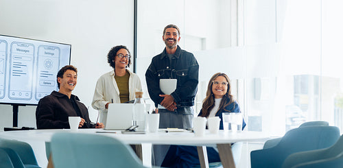 Group of UX designers sharing ideas in meeting