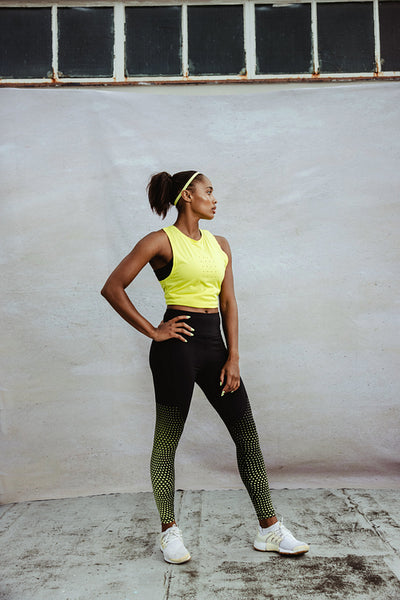 African athlete standing on building terrace