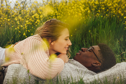 Romantic couple lying in meadow
