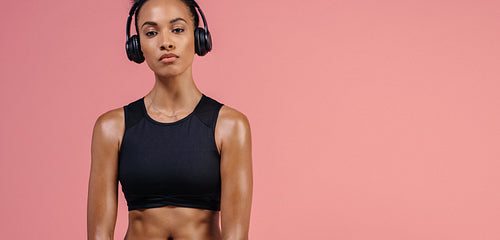 Fitness woman in sportswear and headphones