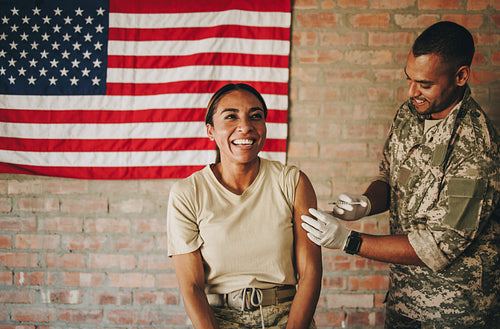 Servicewoman getting vaccinated against covid-19 in the army cli