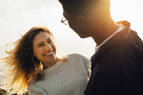 Smiling woman looking at her boyfriend