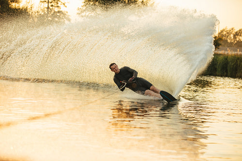 Wakeboarding on a lake with splashes