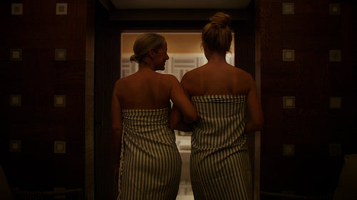 Two women enjoy a luxurious and relaxing spa day together in a traditional hammam