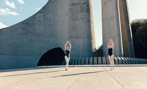 Female ballet dancers practicing duet dance