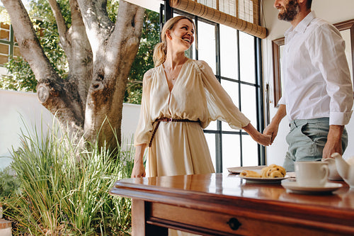 Smiling tourist couple going outdoors for a view