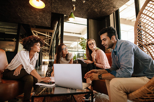 Creative people doing a brainstorming meeting in office