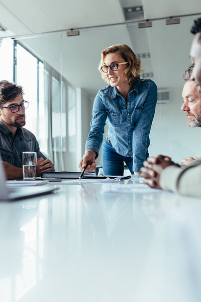 Businesswoman presenting her ideas to coworkers