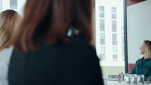 Businesspeople clapping in conference room