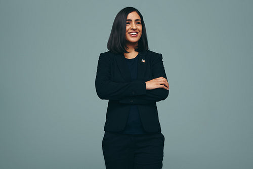 Cheerful congresswoman smiling in a studio
