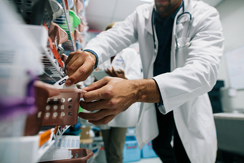 Doctor finding a medicine in hospital pharmacy