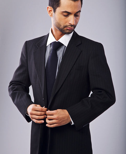 Attractive Businessman Buttoning His Coat