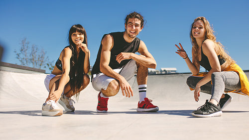 Friends at urban skate park
