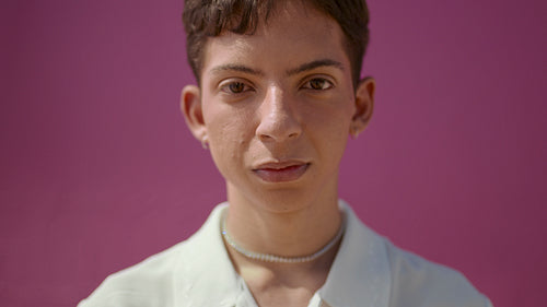 Closeup of a cheerful gender queer