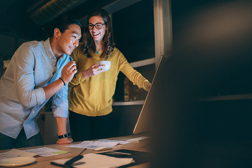 Business partners working late night at office