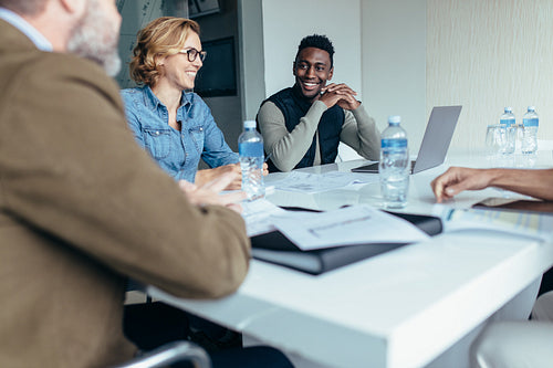 Female manager leads brainstorming meeting in design office
