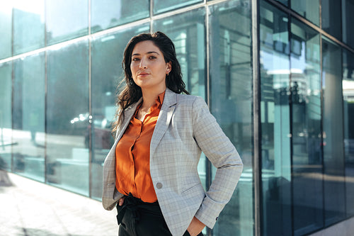 Female white collar worker looking at the camera outdoors
