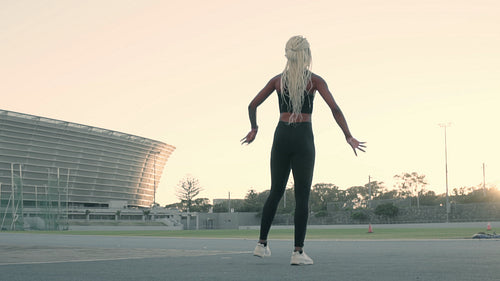 Sprinter warming up before a run