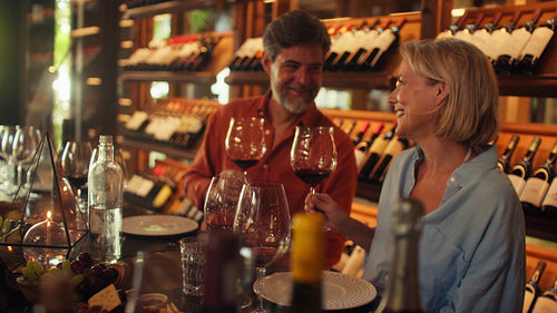 Happy couple enjoys a private wine tasting experience in a luxurious cellar