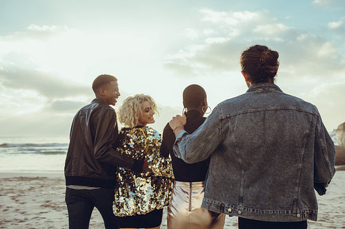 Friends strolling on the beach