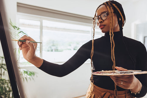 Painter working in her art studio