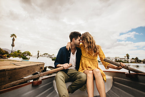 Romantic couple on a boat date in a lake