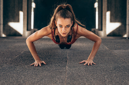 Fit woman doing push ups