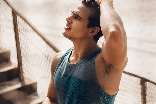 Fitness male model at the beach