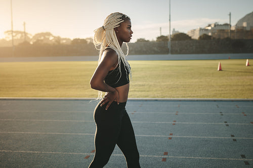 Sprinter walking on running track