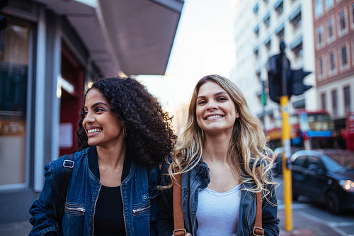 Two women walking in the city