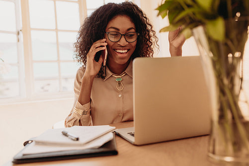 Businesswoman working from home on laptop