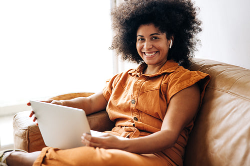 Young businesswoman smiling at the camera in an office lobby
