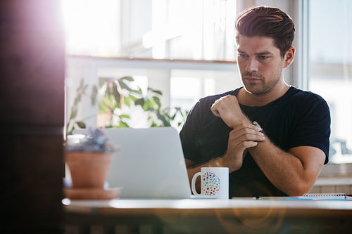 Young businessman working in office