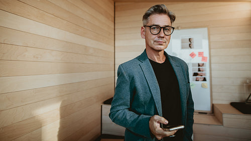Mature businessman with a mobile phone