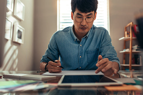 Architect working at his office desk