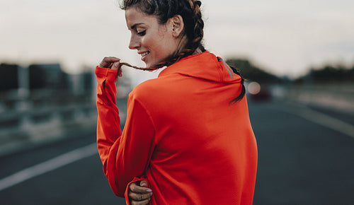 Woman taking break on after a morning run