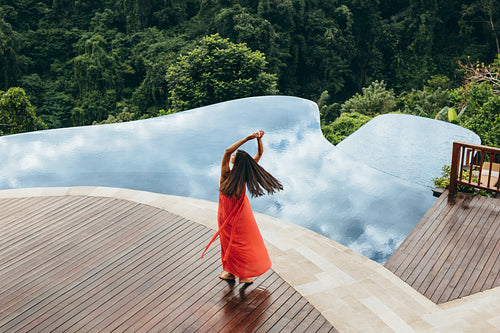 Woman enjoying her vacation at luxury resort
