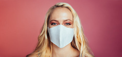 Blonde woman in a protective face mask