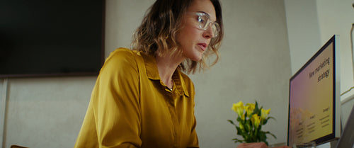 Focused woman working at her home office