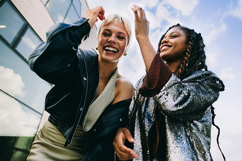 Friends laugh together on the way to a party