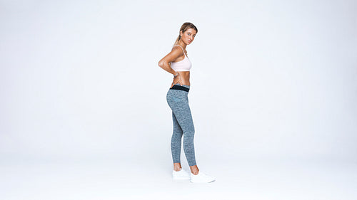 Woman standing in workout clothes