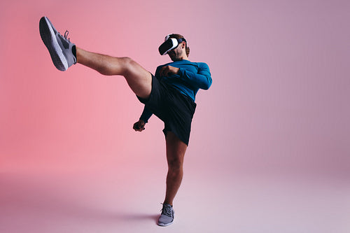 Gamer throwing a kick in virtual reality