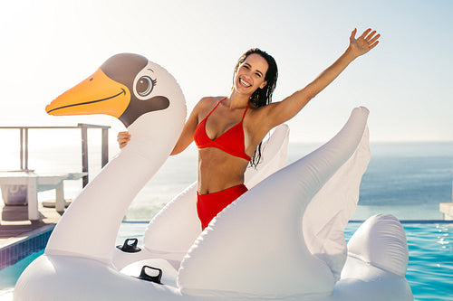 Woman having fun on inflatable toy