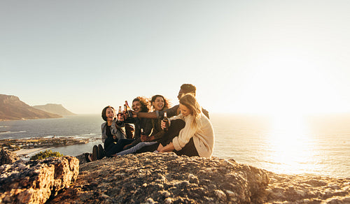 Multiracial group of friends enjoying and partying outdoors