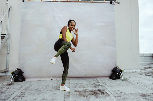 African athlete woman exercising on rooftop