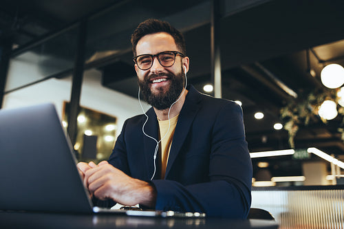 Successful entrepreneur smiling at the camera in an office