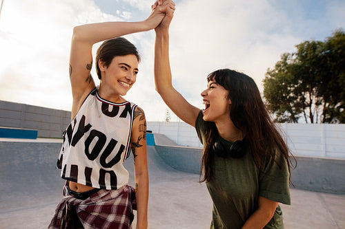 Skaters high five at skate park
